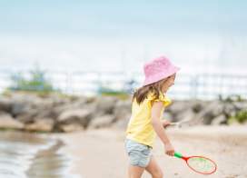 Girl Playing at Lighthouse Park Beach in Manitowoc