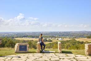 Person looking out at rolling hills