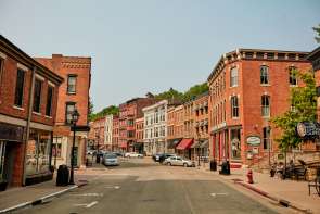 Picture of downtown Galena, Main Street, with brick buildings and cars parked along the street.