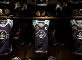 A close up of the Milwaukee Admirals jerseys within the locker room