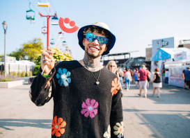 man smiling in a flower setting