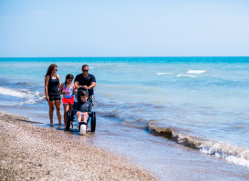 family of 4, son in wheelchair on Bradford Beach