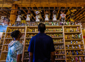 Image of father and son at the National Bobblehead Museum & Hall of Fame