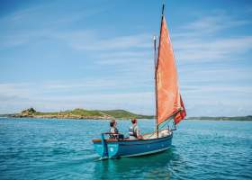 Family sailing around the islands