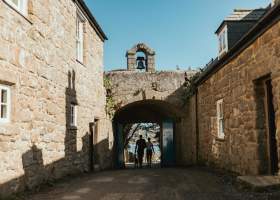 Couple walking through the Garrison Arch