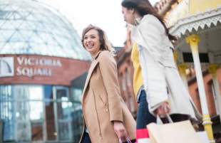 ladies shopping in Belfast, outside Victoria Square Shopping Centre.