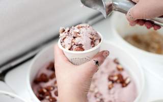 Image of a worker scooping vegan ice cream at Monkeywrench in salt lake city