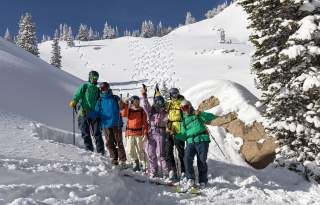 Skiers pose for a group photo in the Wasatch Backcountry