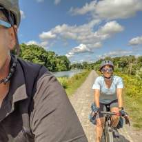 Couple riding bikes at Erie Canal Trail