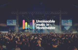 Crowd at a concert with a logo overlay with the words Unmissable Music in Manchester