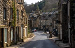 Quaint village street with stone buildings either side