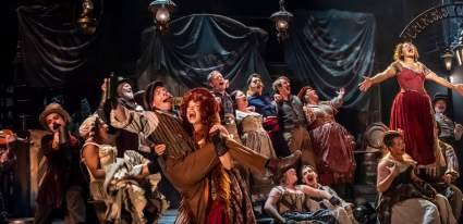 Cast members on stage at Oliver at CFT