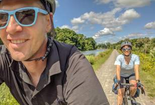 Couple riding bikes at Erie Canal Trail