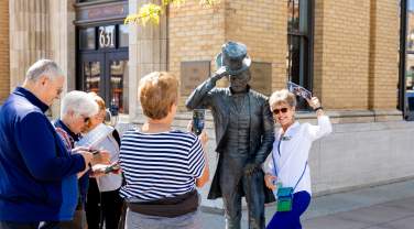 group touring the city of presidents statues found in downtown rapid city, sd