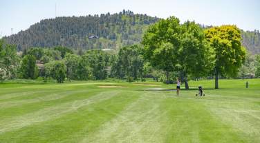 golfer enjoying the meadowbrook golf course in rapid city, sd