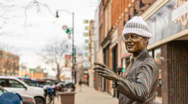 City of Presidents statue Bill Clinton wearing winter gear in downtown Rapid City, SD