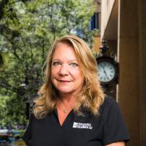 Judie VanPatten Headshot with city background Judie VanPatten Headshot with city background