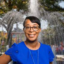 Felicia Nesbitt Headshot with city background