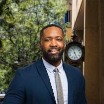 Lem Brown Headshot with city background