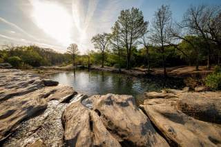 Image of the lower falls at McKinney Falls State Park.