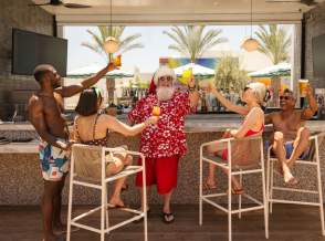 Santa with a group of friends having drinks in Palm Springs.