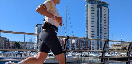 A woman running at Swansea Marina