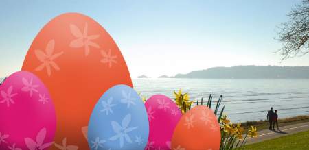 Illustrated Easter eggs overlaid on a photo of Swansea Bay
