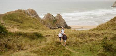 Walkers near Three Cliffs Bay