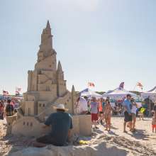 People browse sand castle creations at Texas Sandfest