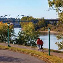 couple walking along the river