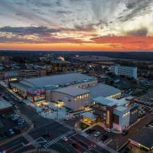 aerial shot of downtown buildings with a vivid sunset