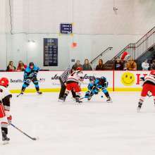 hockey game on an indoor ice rink