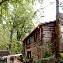 a cabin-style restaurant in a wooded setting