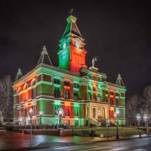 red and green lights cover a historic courthouse