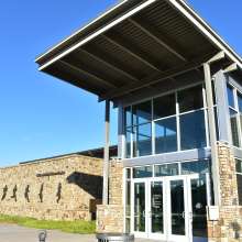 event center with silhouette stances of a runner along the side