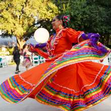 Woman dancing in red Folklorico dress