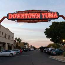 Downtown Yuma sign lit at twilight