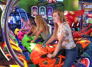 A group of young people enjoying Carlisle Sports Emporium's indoor arcade.