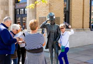 group touring the city of presidents statues found in downtown rapid city, sd