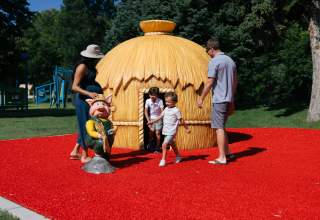 family playing in play set found at storybook island in rapid city, sd