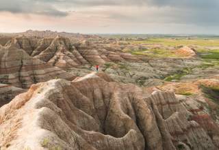 Woman walking on trail in Badlands National Park