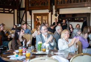 Group applauding at a businesses event in Rapid City, SD