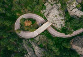 Drone shot above the pigtail and mountain tunnel of iron mountain road in the black hills