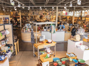 Interior of Boelter Superstore in Milwaukee, featuring wide aisles filled with kitchenware, cookware, and culinary tools, with shelves and display tables showcasing colorful bowls, utensils, and gift items.