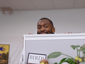 Bobby Portis peaking over the top of a grey cubical wall
