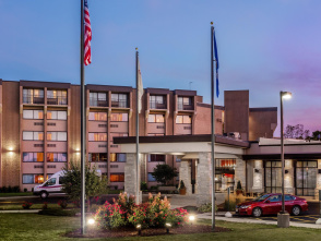 A view of the Crowne Plaza Hotel from it's parking lot at dusk