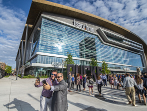 meeting attendees taking a selfie in front of Fiserv Forum during Northwestern Mutual's annual meeting
