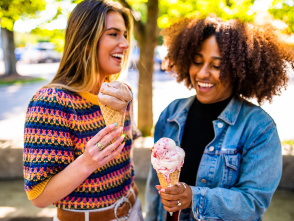 two women holding frozen custard and laughing