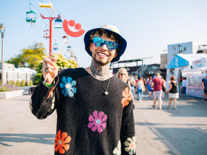 man smiling in a flower setting