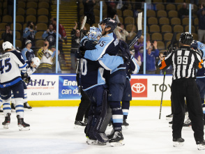 Admirals players hugging and cheering